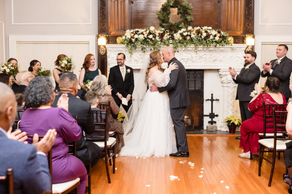 Bride and groom kissing after ceremony at Stewart Manor Country Club.