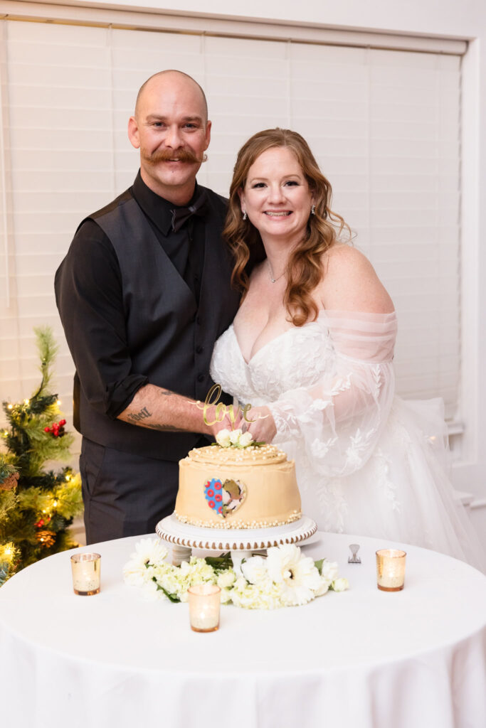 Bride and groom cutting cake at Stewart Manor Country Club.