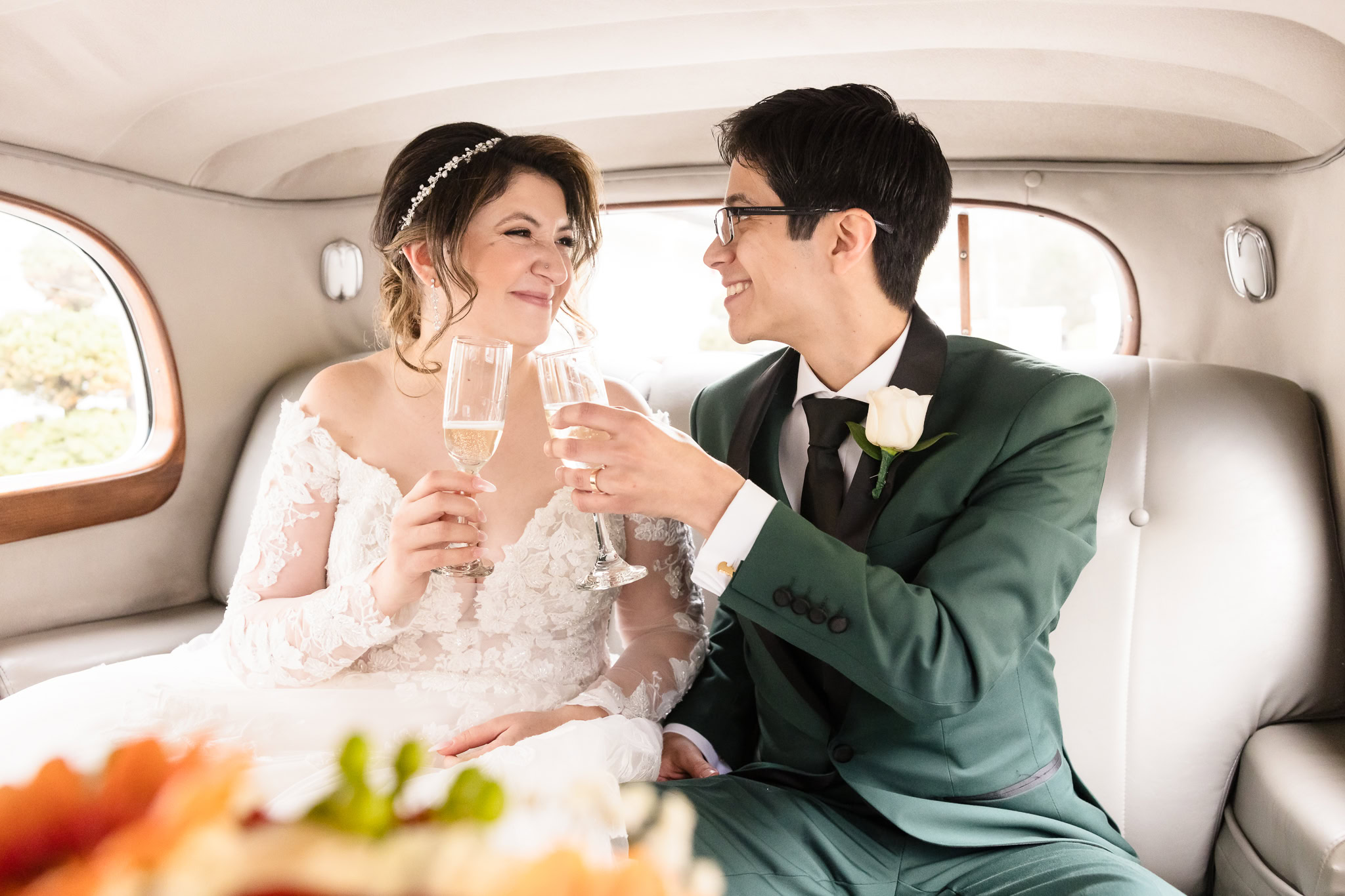 Bride and groom in limo arriving at Water's Edge