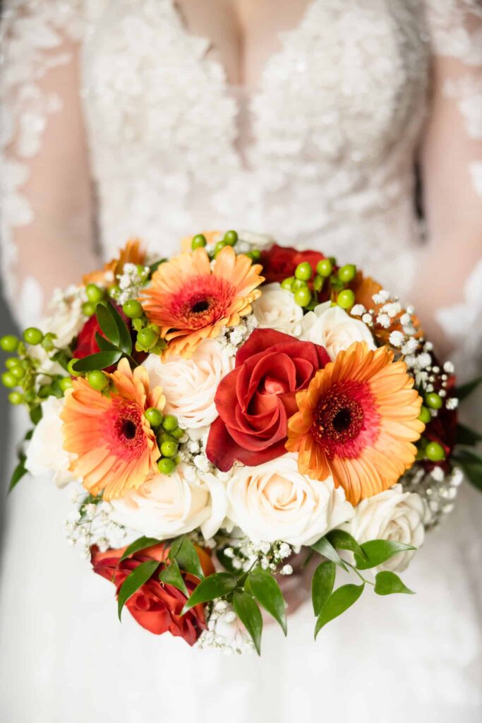 Image of colorful bridal bouquet held by bride