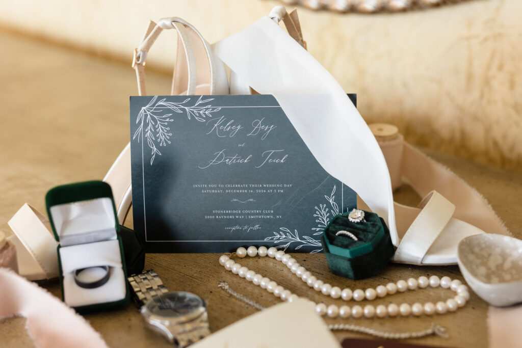 Invitations, rings, and other details at the bridal suite at Stonebridge Country Club.