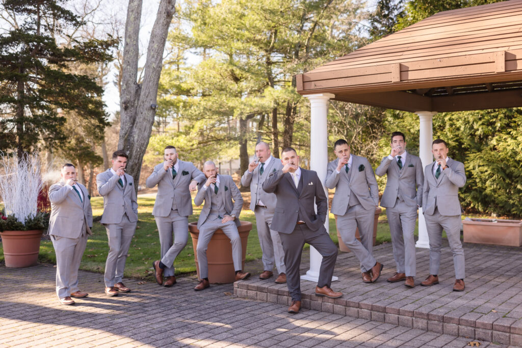 Groom and groomsmen looking at the camera in an editorial pose at Stonebridge Country Club.