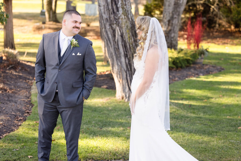 Groom turning to see bride for the first time before their Stonebridge Country Club wedding. 