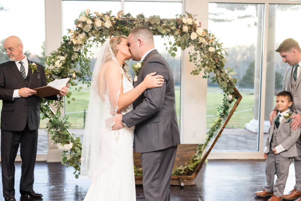 Bride and groom first kiss at Stonebridge Country Club wedding. 