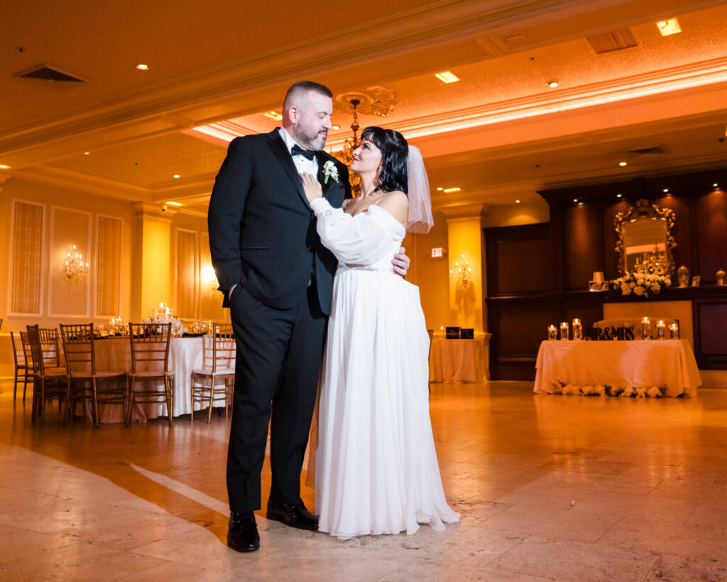 Bride and groom in middle of the dance floor at The Inn at New Hyde Park before guests arrive. 