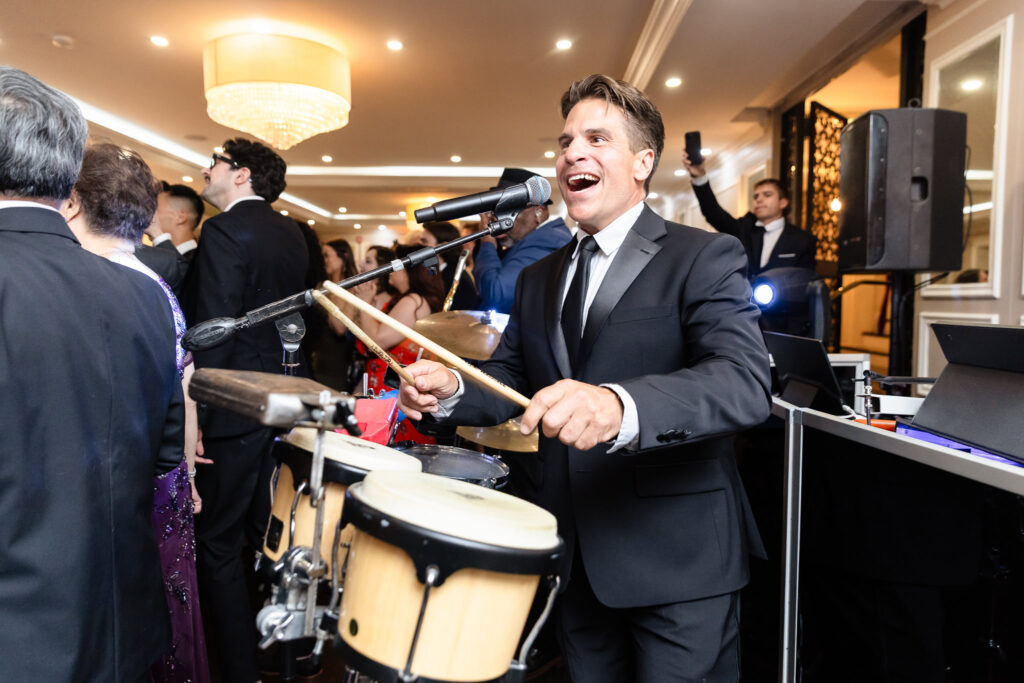 Percussionist in action, energizing the crowd at The Briarcliff Manor wedding reception.