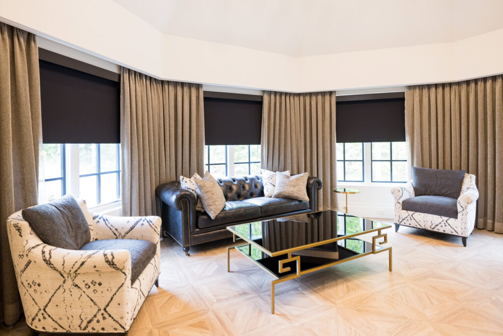 Elegant getting-ready suite at Water’s Edge Centerport with natural light and sophisticated lounge furniture.