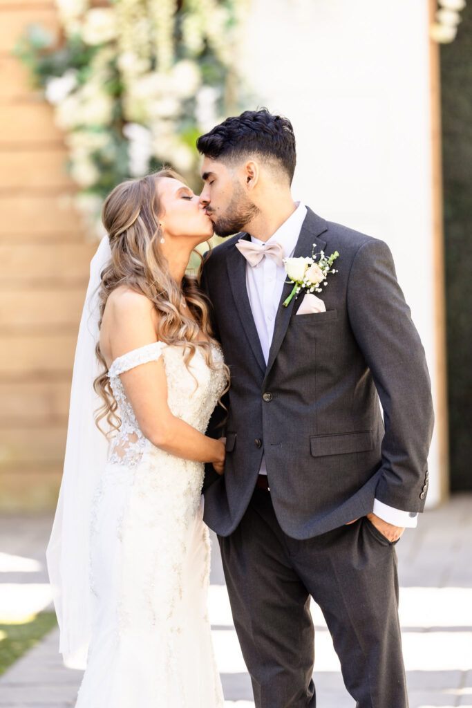 Bride and groom sharing a soft kiss