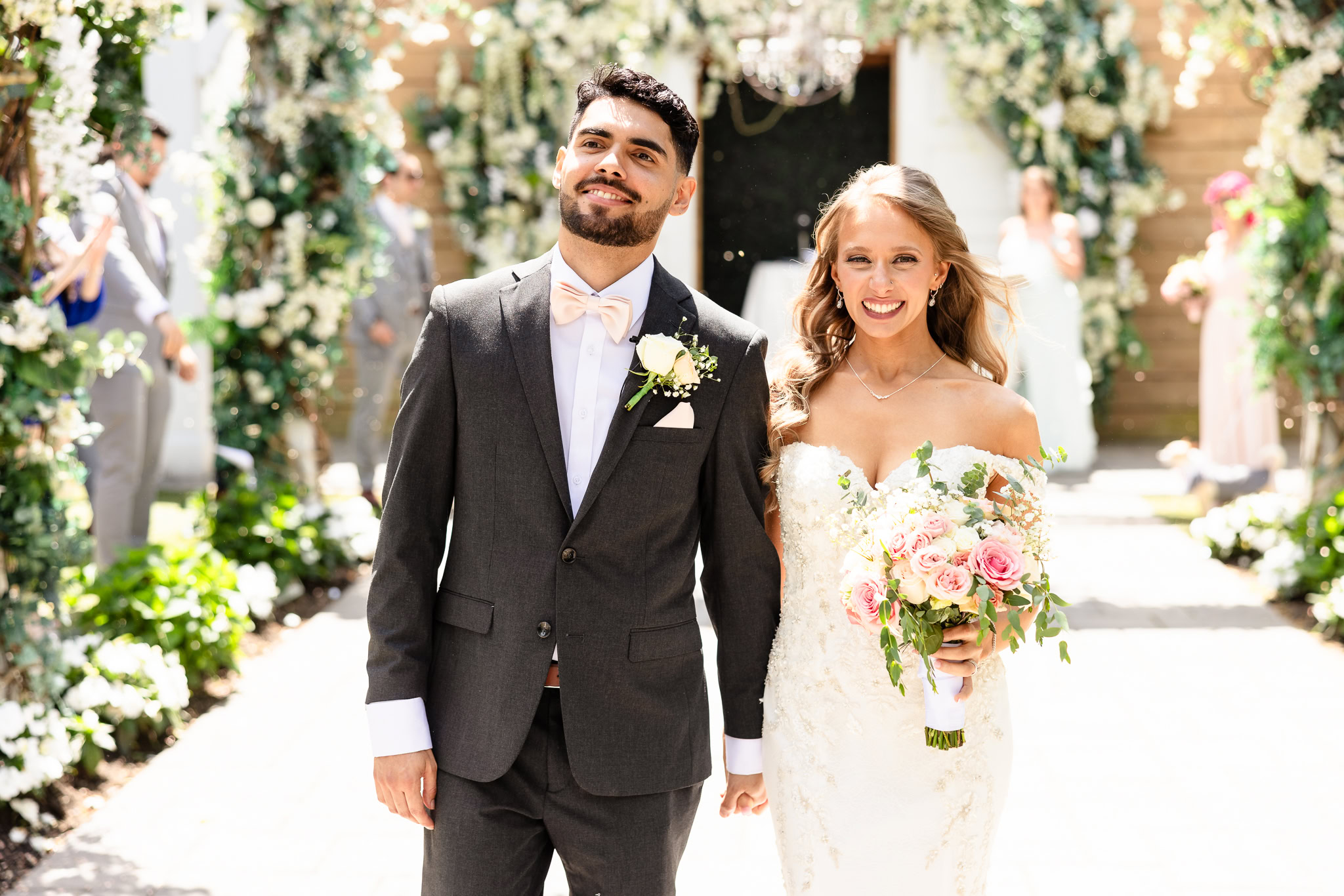 Bride and groom walking down the aisle as husband and wife