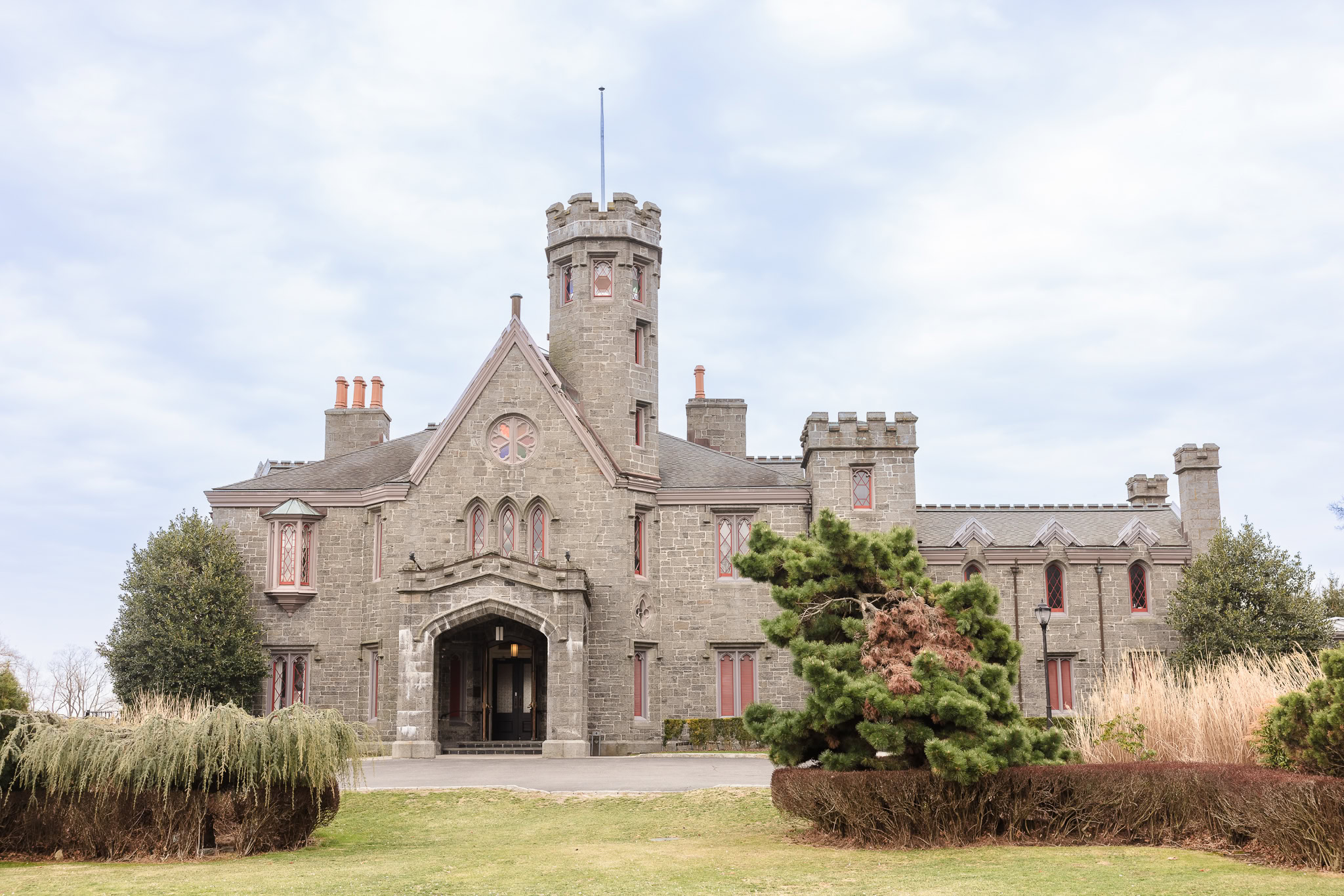 Exterior view of Whitby Castle in Rye, NY on a wedding day, showcasing historic Gothic Revival architecture