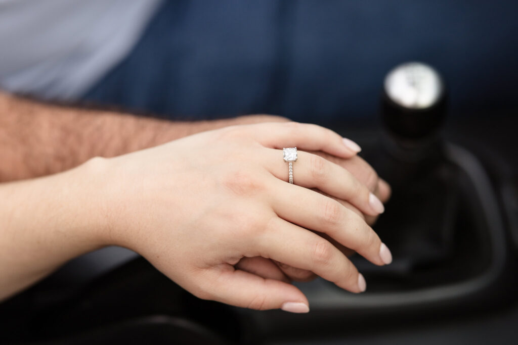 Couple holding a gear shirt together. 