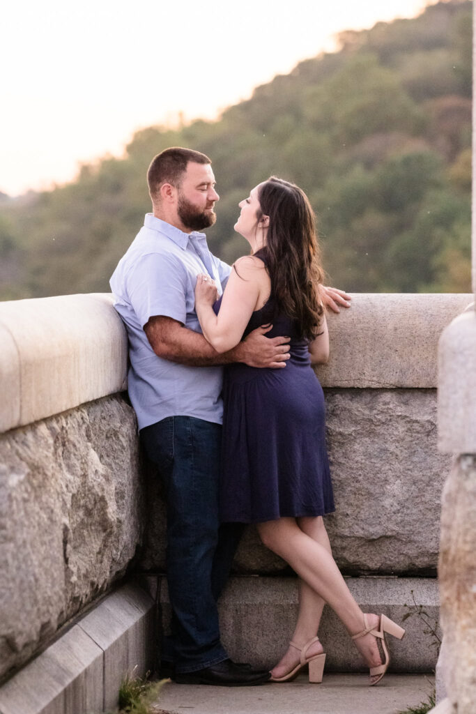Couple about to kiss on Croton Dam at their Croton Gorge Park engagement session.
