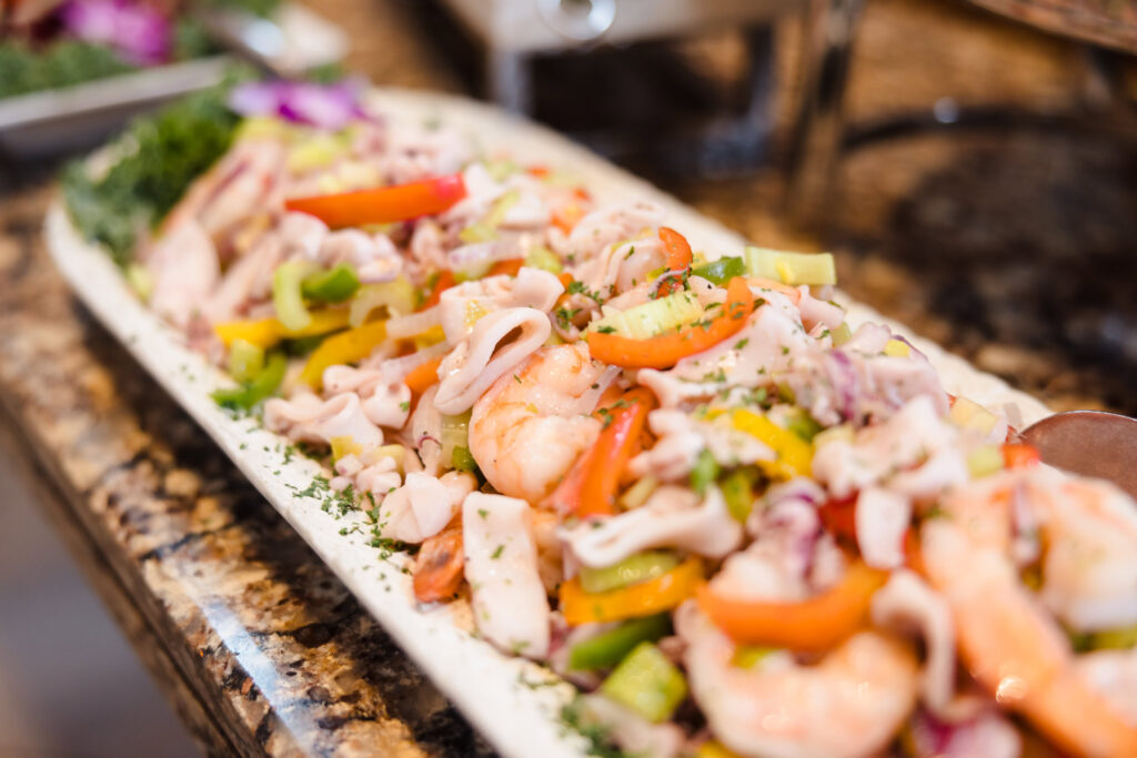 Colorful seafood salad with shrimp, calamari, and vegetables served at a wedding reception on Long Island.
