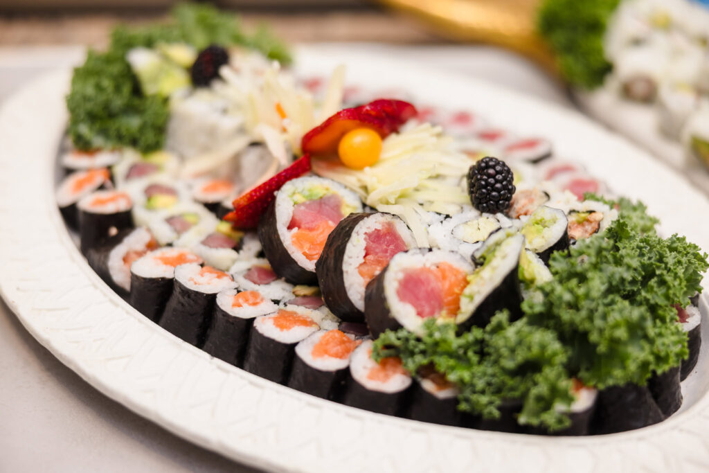 Assorted sushi platter with fresh rolls and garnishes served at a wedding reception on Long Island.