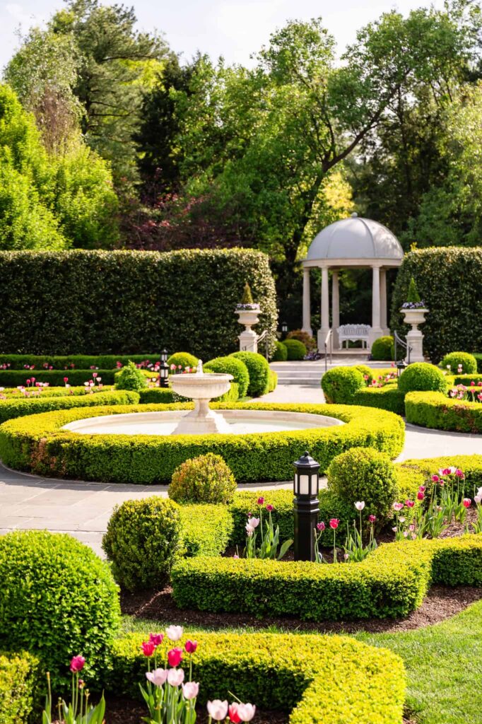 Symmetrical garden fountain and domed gazebo at Park Chateau Estate and Gardens in East Brunswick, NJ, an iconic backdrop for a Park Chateau wedding portrait.