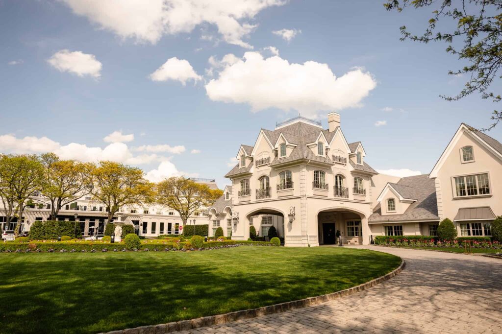 Grand exterior view of Park Chateau Estate and Gardens in East Brunswick, NJ, featuring sweeping driveway and manicured lawns at this luxury NJ estate wedding venue.