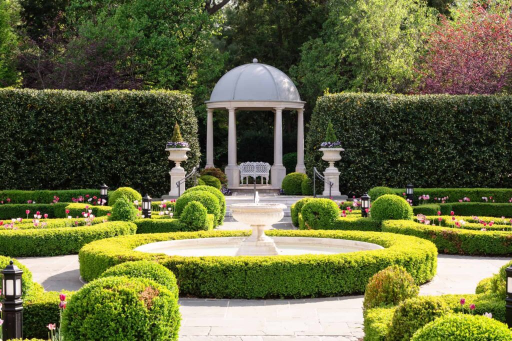 Sunlit formal gardens with fountain and domed gazebo at Park Chateau Estate and Gardens in East Brunswick, NJ, a timeless setting for a Park Chateau wedding.