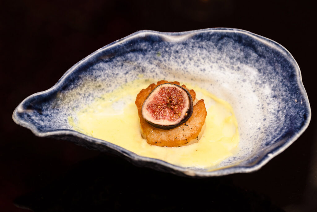 Gourmet scallop appetizer with fig garnish presented during the Blush Hour culinary showcase at NY.