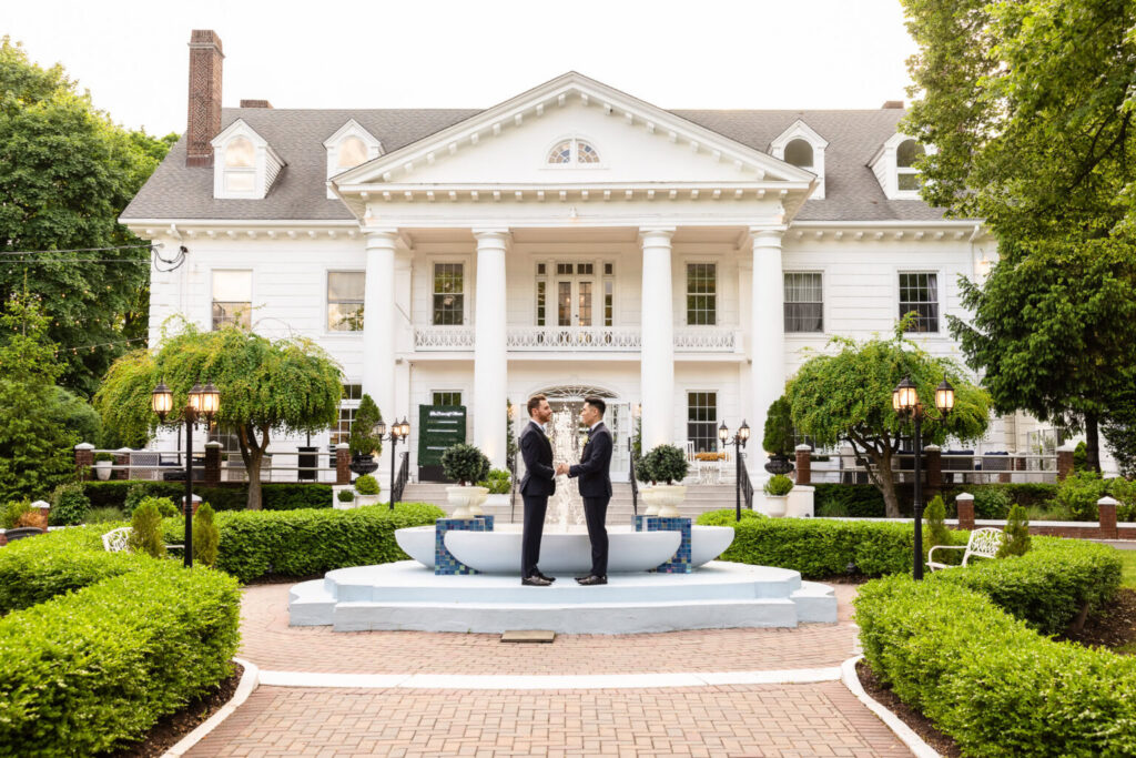 Couple standing together in front of Briarcliff Manor wedding venue in Westchester County.