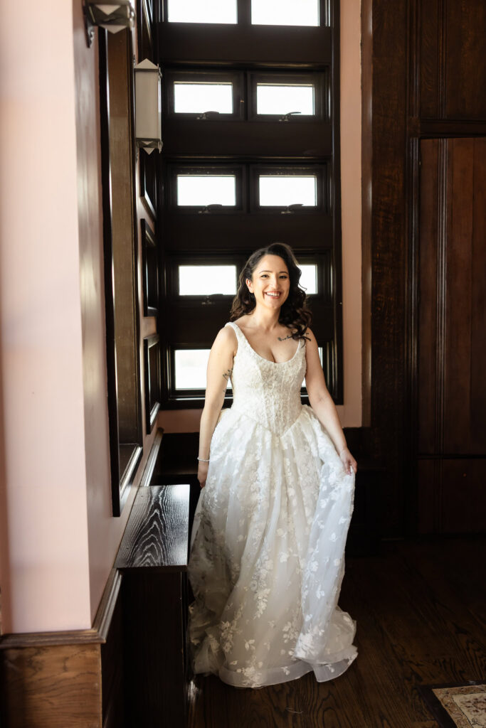 Bride in a vintage-inspired wedding gown posing inside Gatsby on the Ocean.