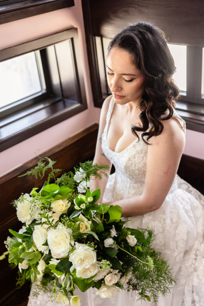 Bride holding a period-inspired bouquet during a 1920s wedding on Long Island at Gatsby on the Ocean.