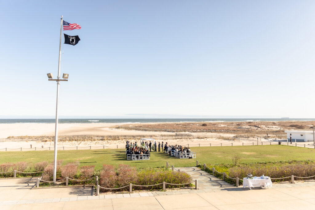 Wide view of an oceanfront ceremony setup.