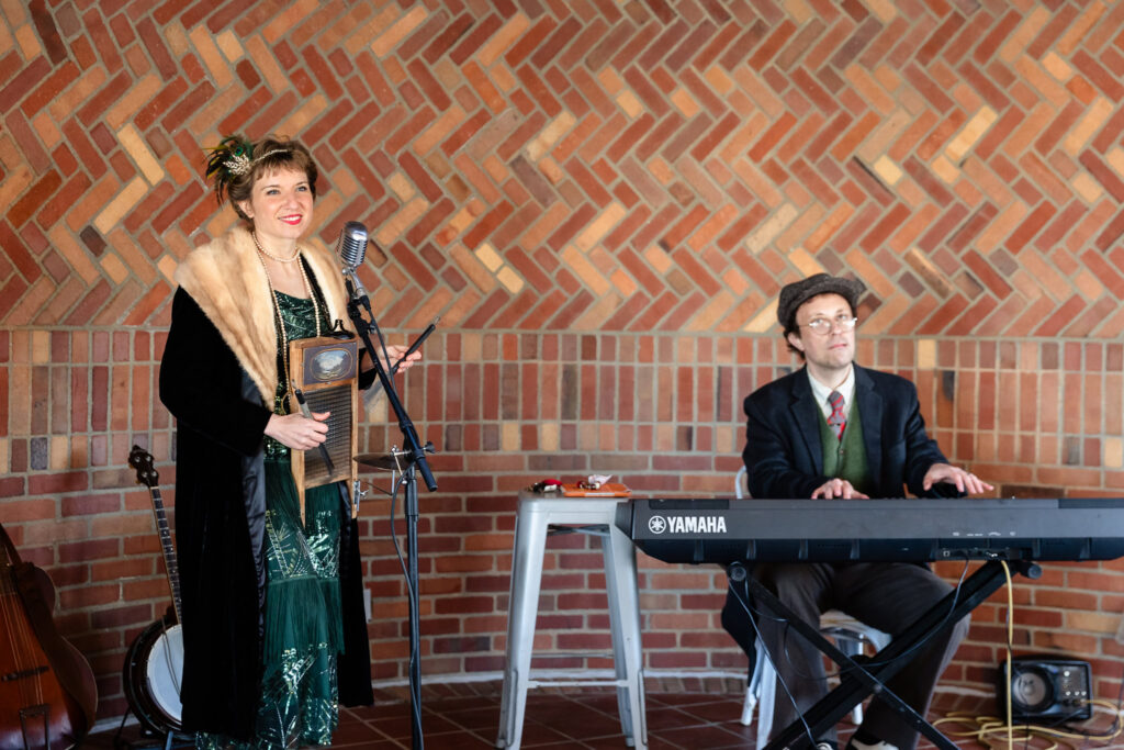 Musicians in period-inspired attire performing live entertainment at a 1920s wedding Long Island reception.