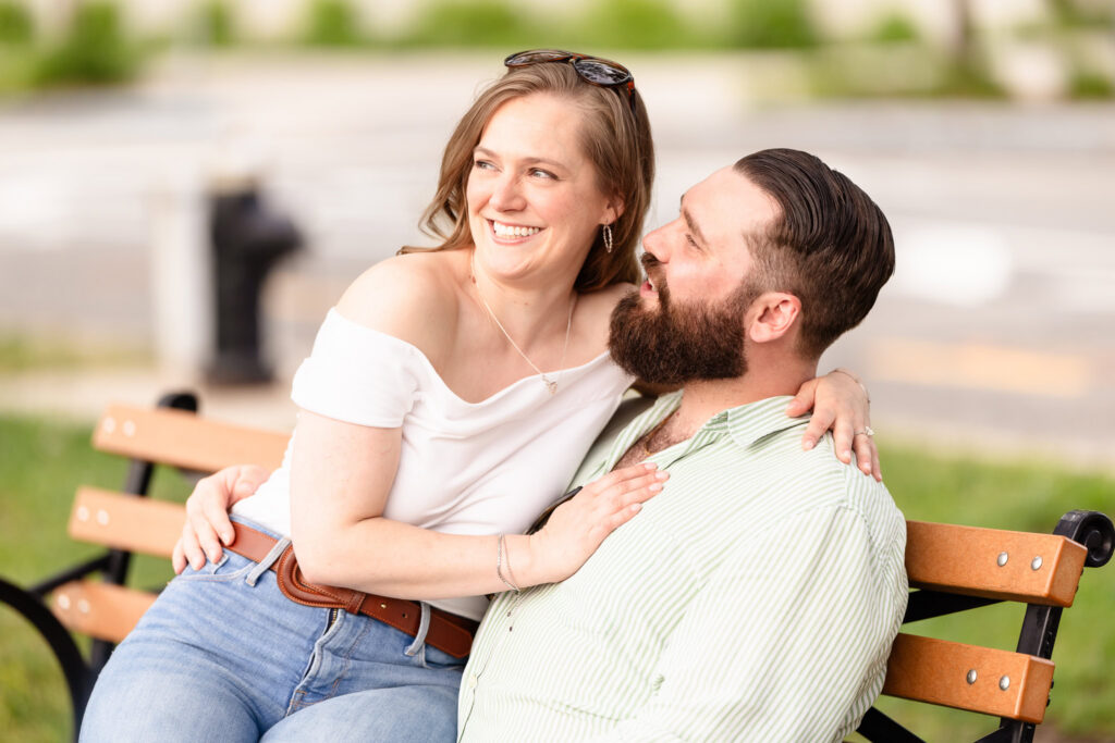 Candid bench portrait from a Roosevelt Island engagement session.