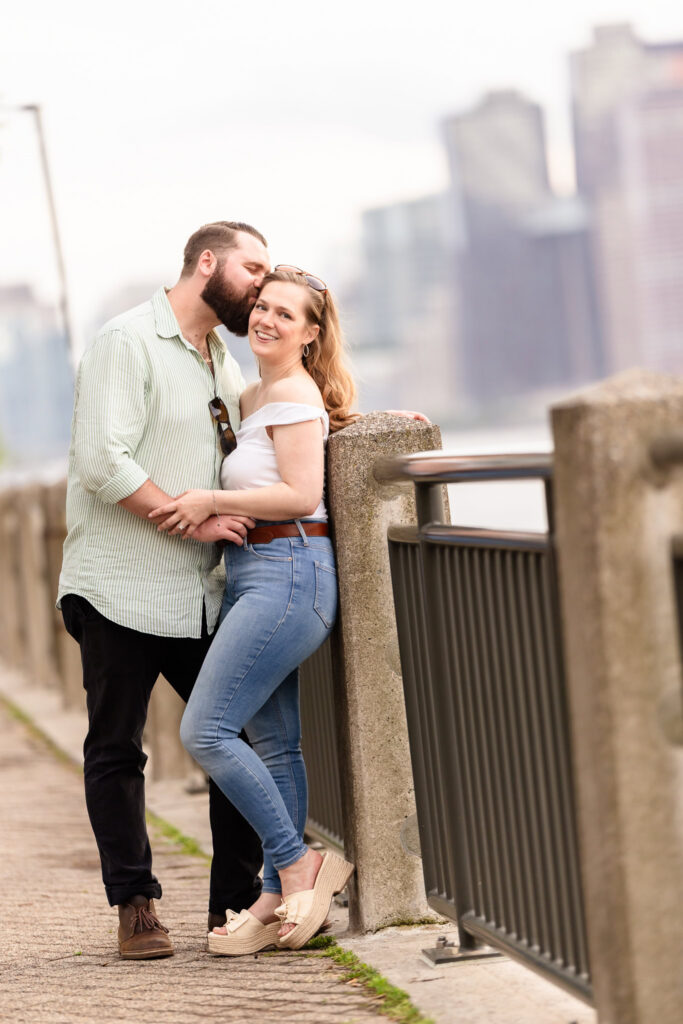 Roosevelt Island engagement session portrait featuring the Queens skyline.
