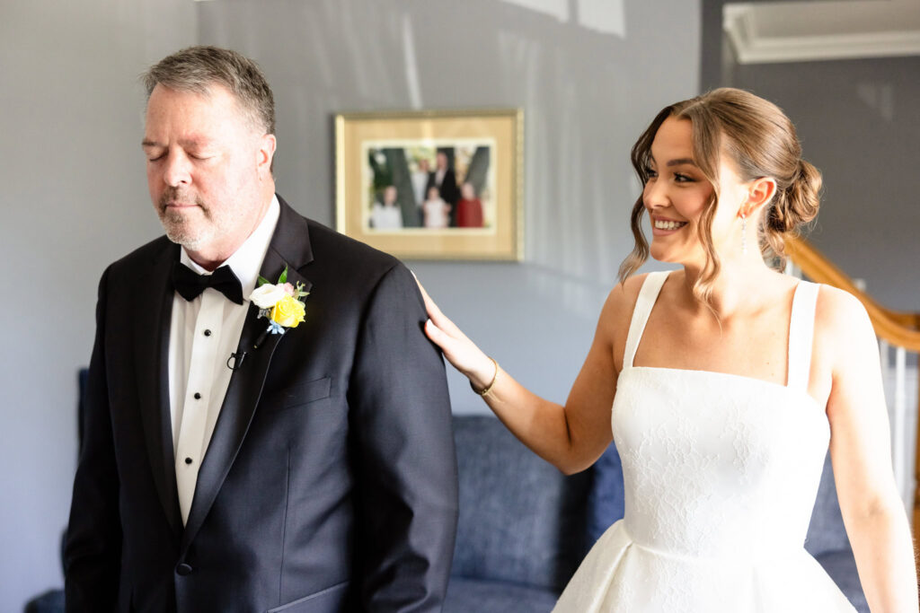 Ashley shares an emotional first look with her father before their special moment together on her wedding day.