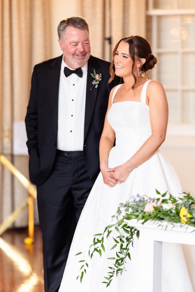 Ashley smiles as her father delivers a heartfelt speech during the reception at The Heritage Club at Bethpage.