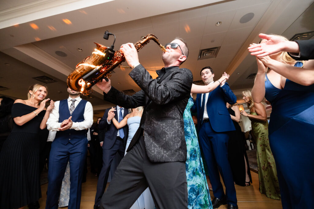 Live saxophonist entertaining guests on the dance floor.