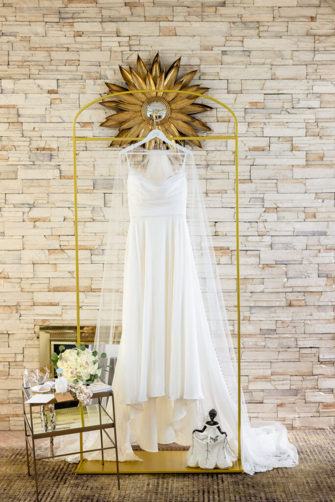 Bridal gown and veil displayed inside the venue before a spring wedding at Land's End.