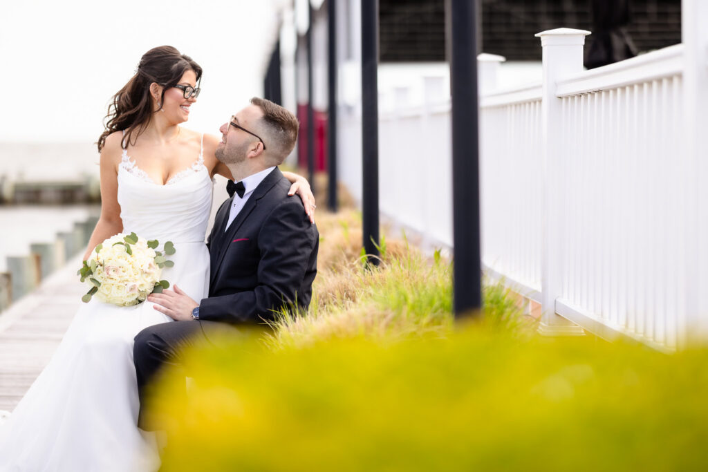 Bride and groom sharing a quiet moment by the bay during a spring wedding at Land's End.