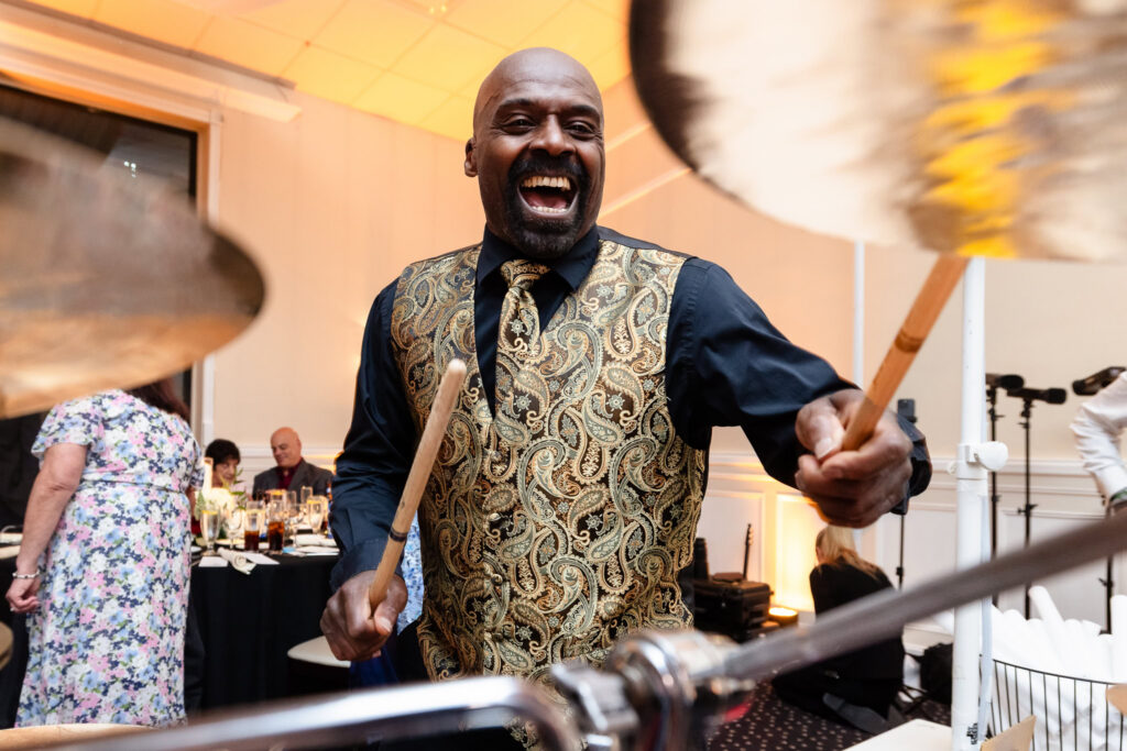 Live drummer performing during the high-energy reception.