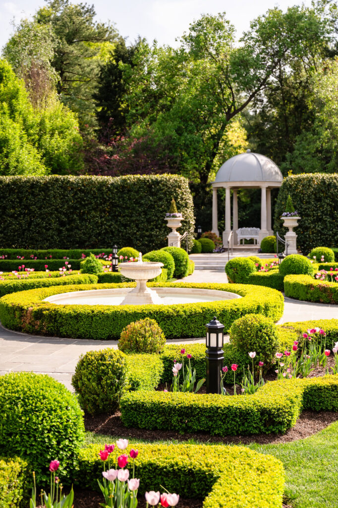 Formal garden fountain and gazebo, offering a timeless backdrop for portraits.