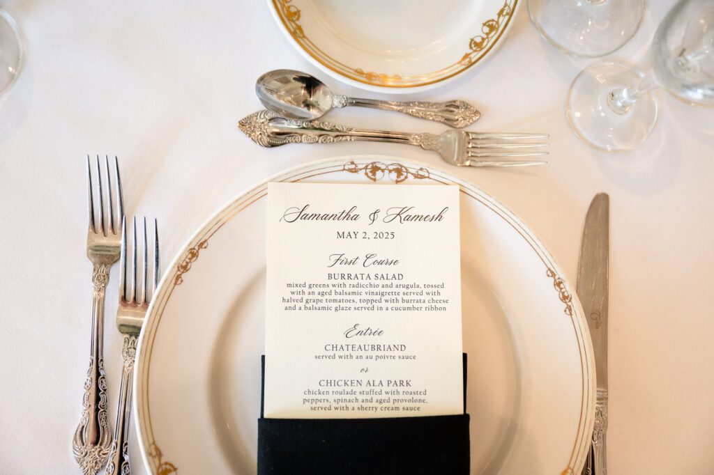 Elegant reception place setting and custom menu design at a Park Chateau Wedding reception.