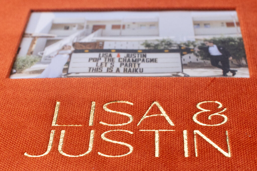 Personalized linen wedding album with custom embossing, showcasing why wedding albums matter as meaningful keepsakes.