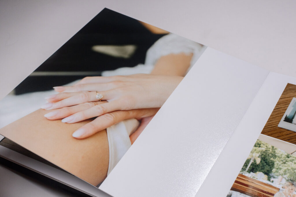 Layflat wedding album featuring a bridal ring photograph, demonstrating why wedding albums matter for telling your complete story.