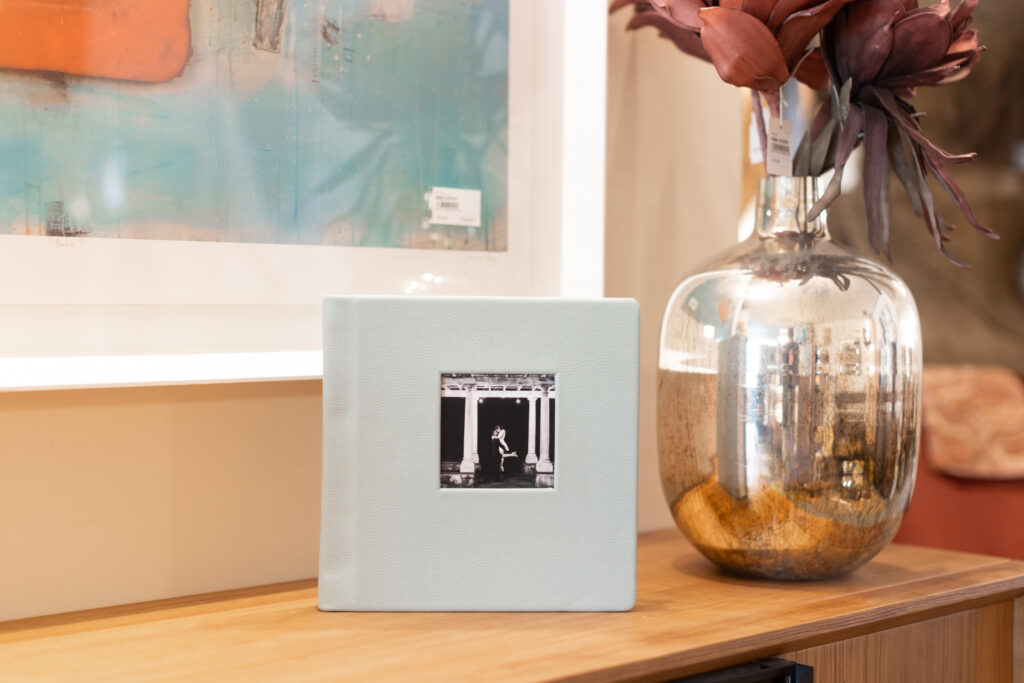 Luxury wedding album displayed in a home, showing why wedding albums matter as everyday family heirlooms.