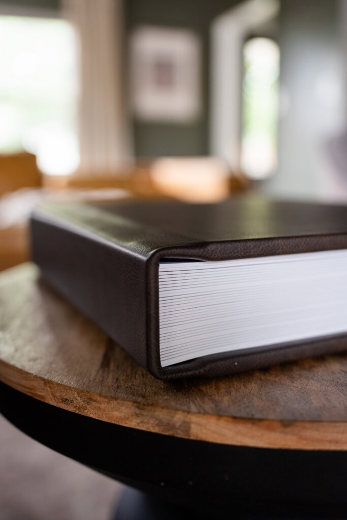 Premium leather displayed on a wooden table.