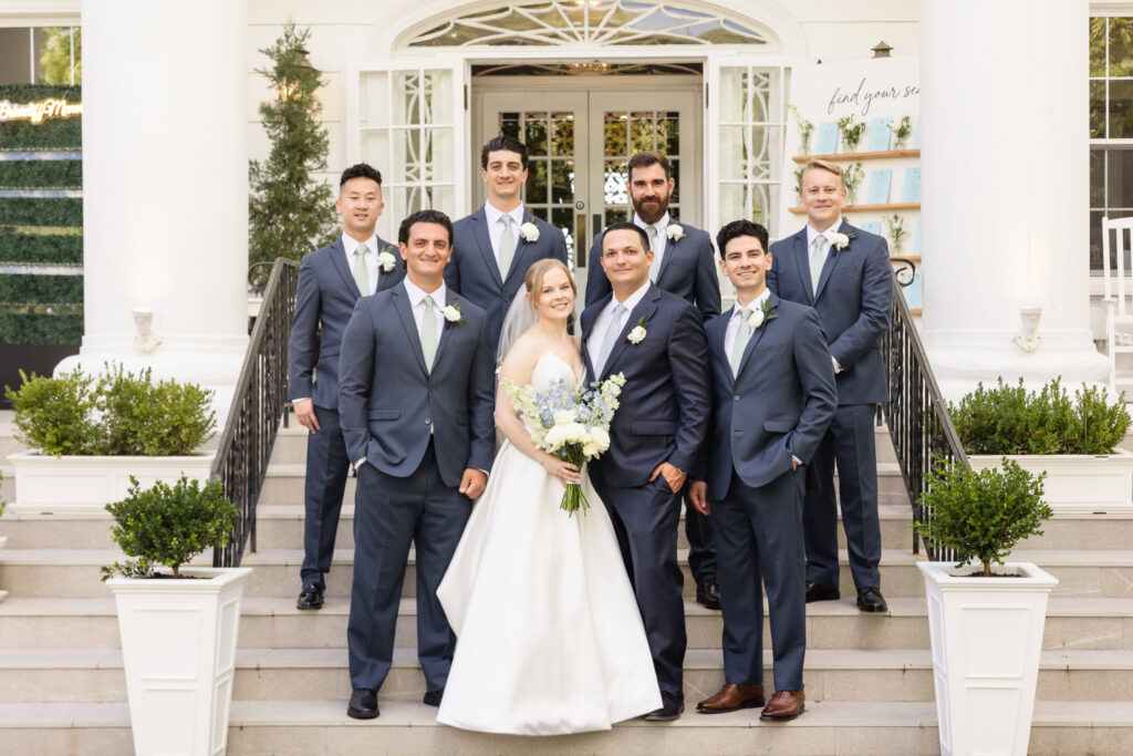 Lydia and Robbie pose with the groom's wedding party outside Briarcliff Manor during formal portraits before the ceremony.