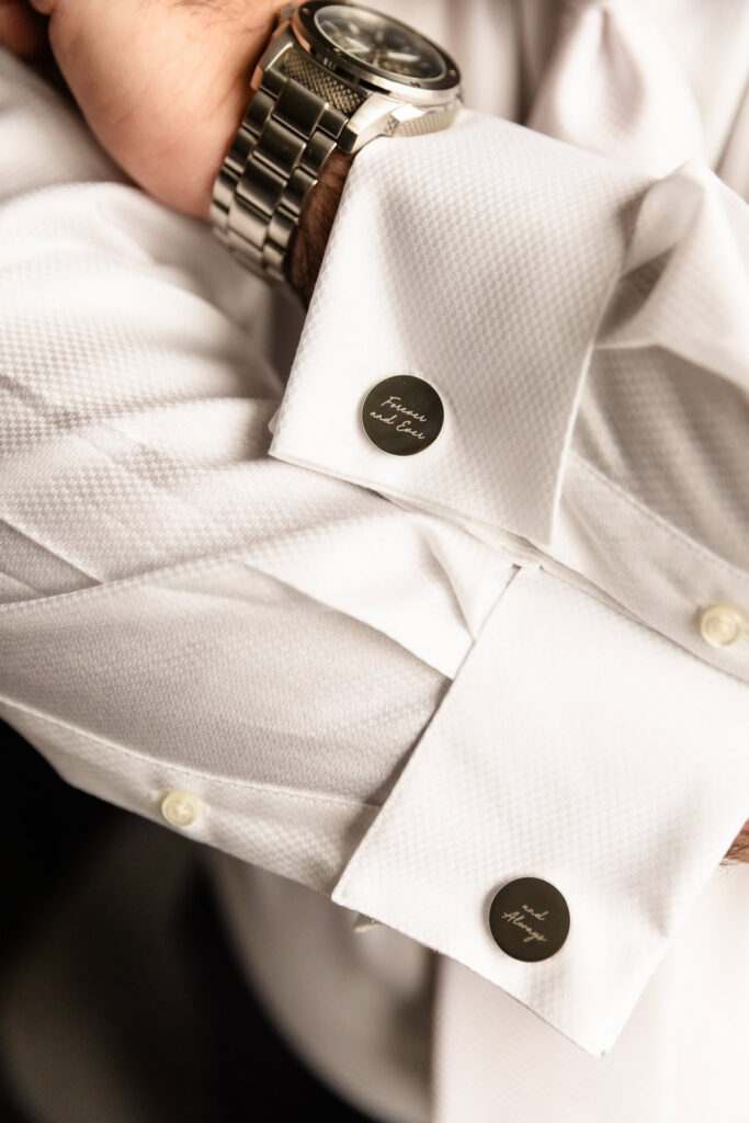 Personalized groom cufflinks and watch detail photographed before a Harbor Club at Prime wedding.