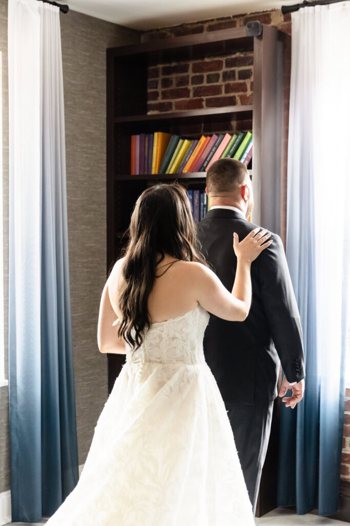 Bride approaching the groom for their emotional first look before their Harbor Club at Prime wedding.