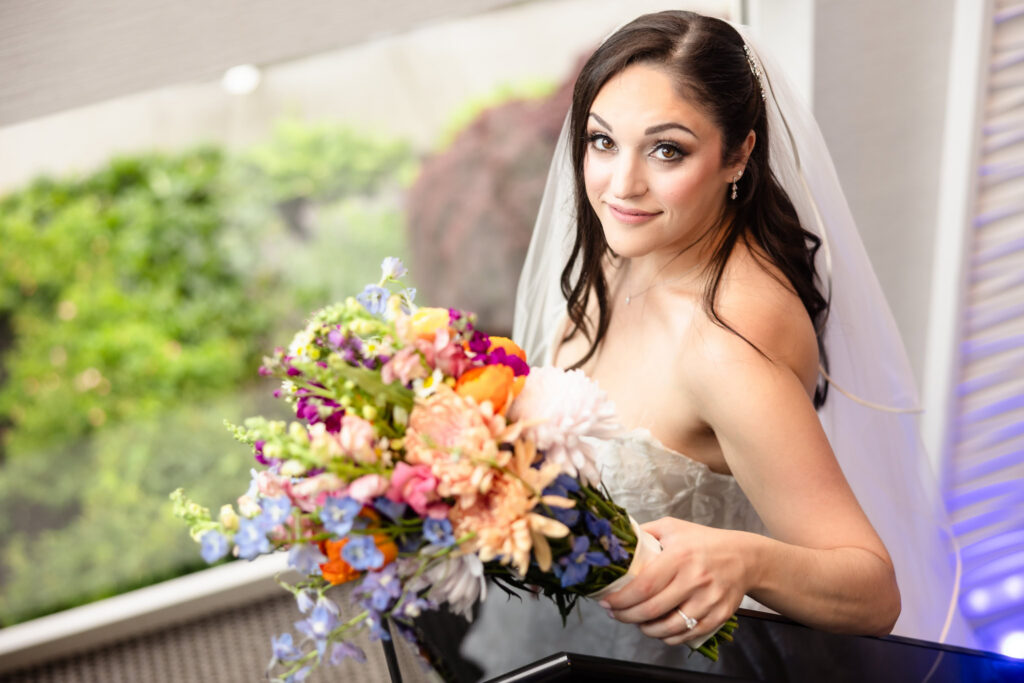 Bridal portrait with a vibrant bouquet captured before the ceremony at a Harbor Club at Prime wedding.