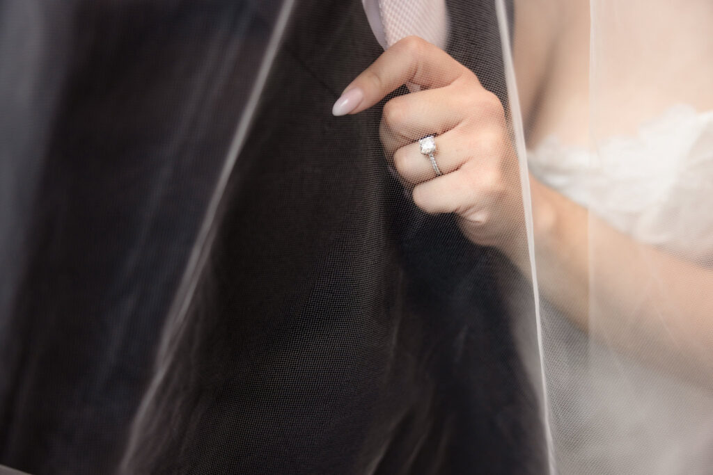 Close-up of the bride's engagement ring beneath her veil during a Harbor Club at Prime wedding.