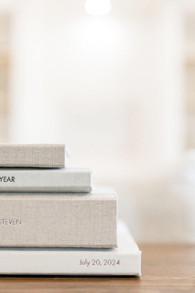 Stack of professionally crafted heirloom wedding albums.