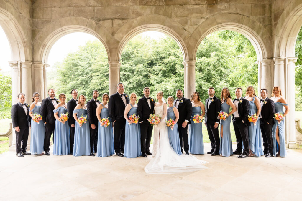 Lauren and Joe with their full wedding party at Planting Fields Arboretum before their reception at Watermill Caterers in Smithtown.