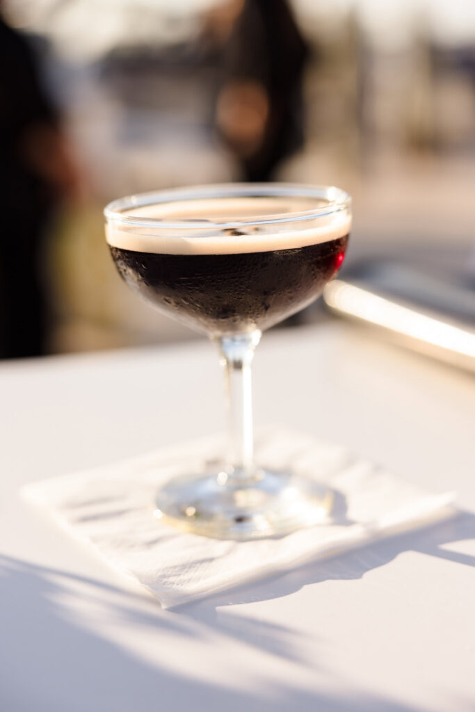 Espresso martini photographed in the evening light during a waterfront event at EHP Resort.