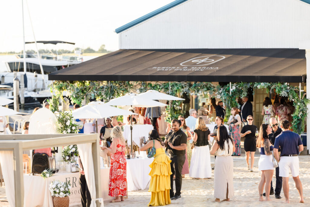 Guests gathering outside Shagwong Boat Club during a waterfront event at EHP Resort and Marina.
